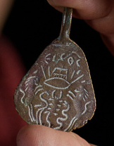 A 1,500-year-old amulet bearing God's name, found in northern Israel 40 years ago and handed to the Israel Antiquities Authority in May 2021. (Dafna Gazit/Israel Antiquities Authority)