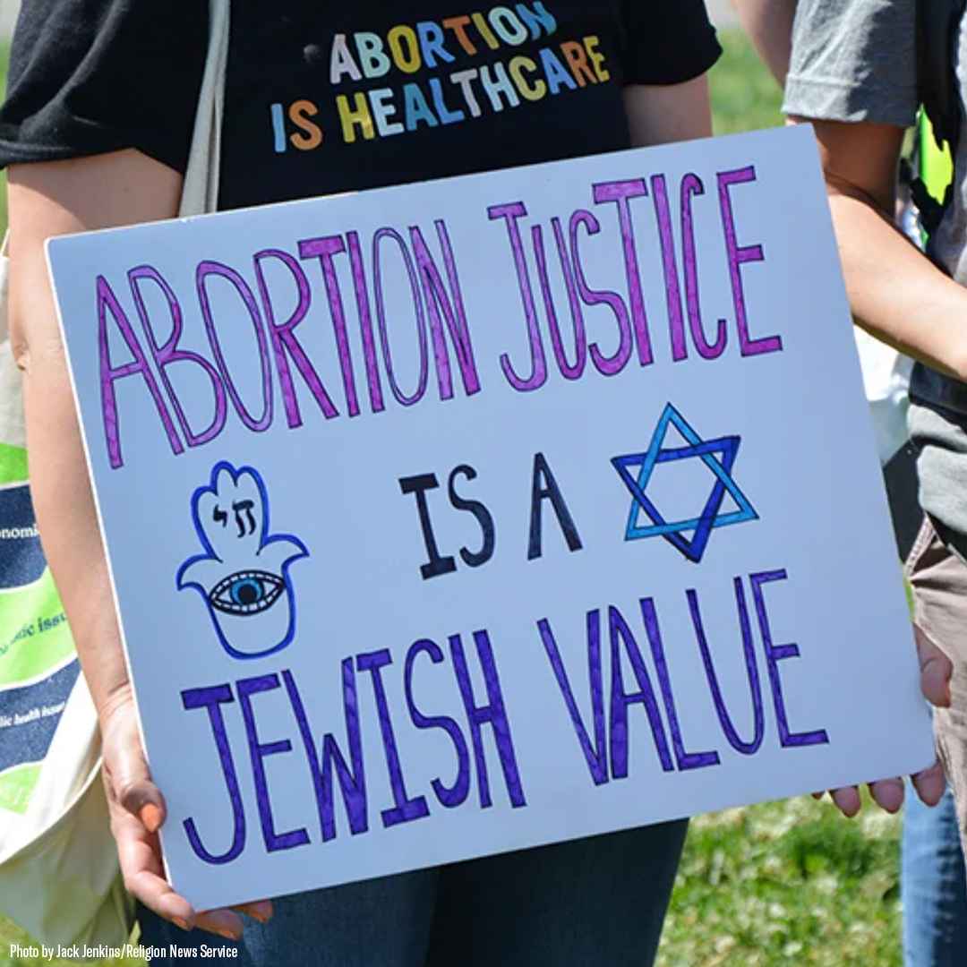 Sign says Abortion Justice is a Jewish Value and has a hamsa and a jewish star